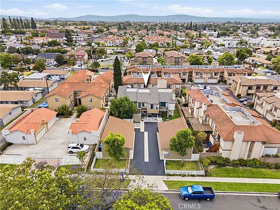 Aerial view of 12582 Adelle Street, a five-unit residential investment property in West Garden Grove with mountain ridge in the distance